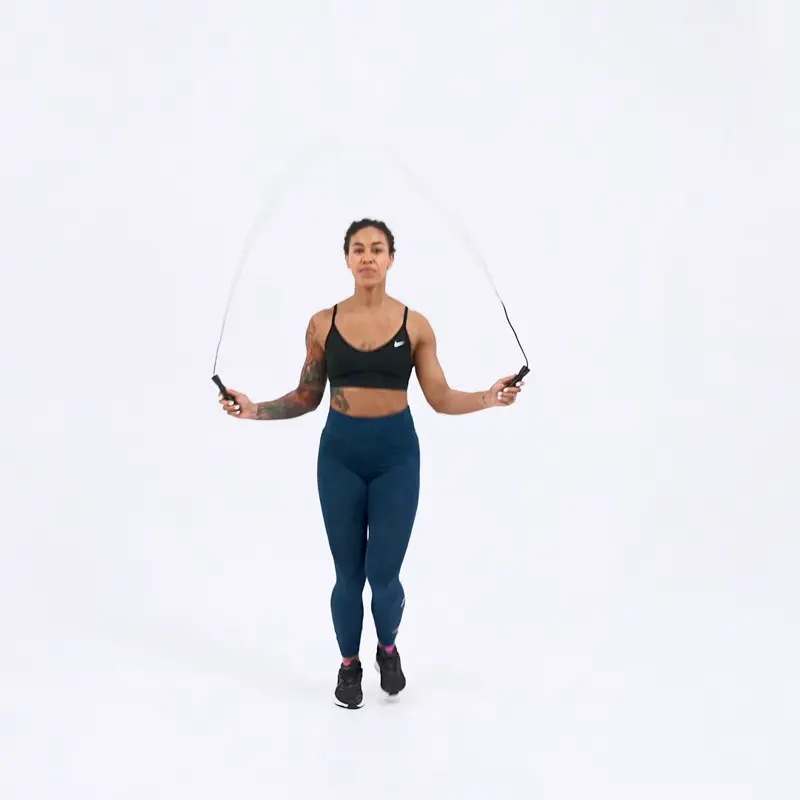 a woman is working out, jumping rope_how to lose weight in thighs and butt